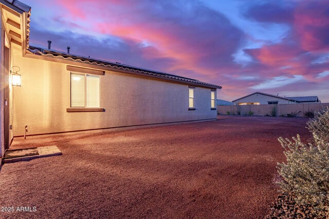 19873 W San Juan Ave, Litchfield Park, AZ 85340 - view of side of property featuring fence, a tile roof, and stucco siding
