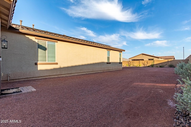 19873 W San Juan Ave, Litchfield Park, AZ 85340 - view of home's exterior featuring fence and stucco siding