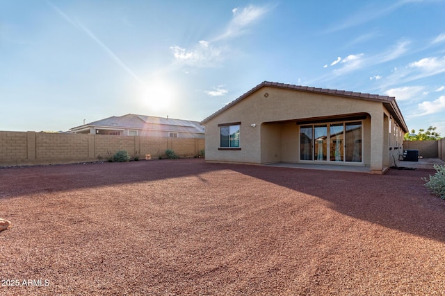 19873 W San Juan Ave, Litchfield Park, AZ 85340 - rear view of property featuring a fenced backyard, stucco siding, and cooling unit