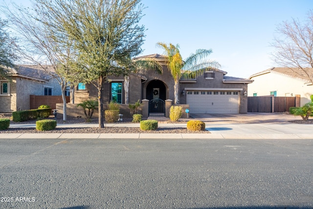 20138 E Estrella Rd, Queen Creek, AZ 85142 - view of front of house featuring a fenced front yard, a garage, concrete driveway, a gate, and stucco siding