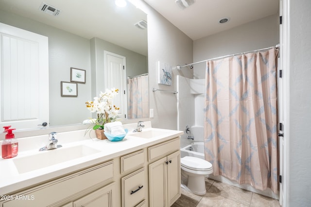 full bath featuring toilet, a sink, and visible vents