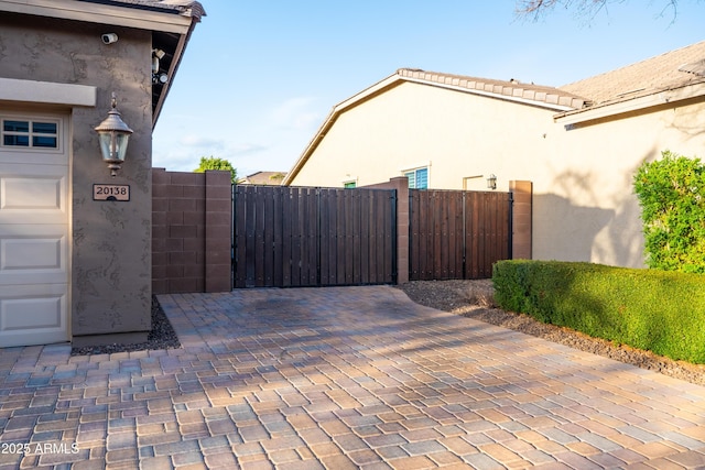 view of gate featuring fence