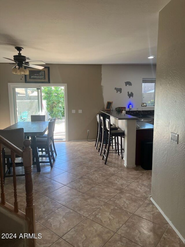 dining room featuring ceiling fan