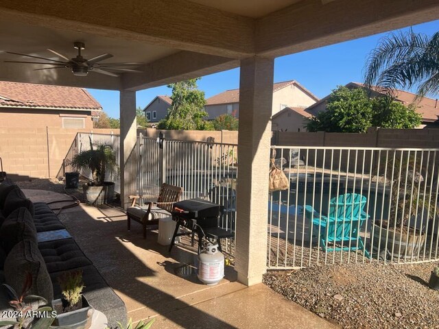 view of patio featuring ceiling fan