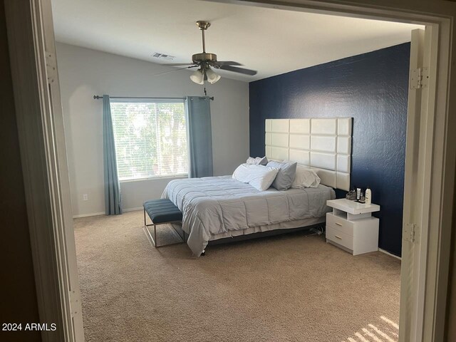 carpeted bedroom featuring ceiling fan