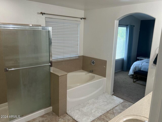 bathroom featuring tile patterned floors, separate shower and tub, and vanity