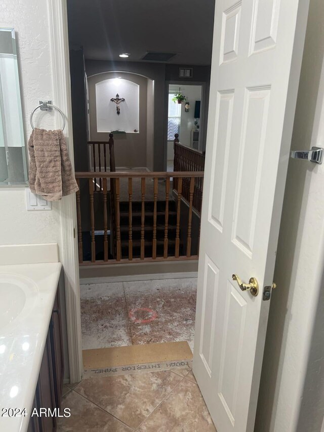 bathroom with vanity and tile patterned floors