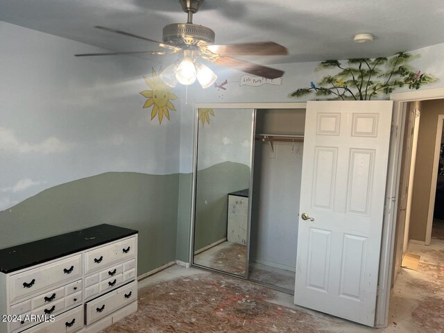 bedroom with ceiling fan and a closet