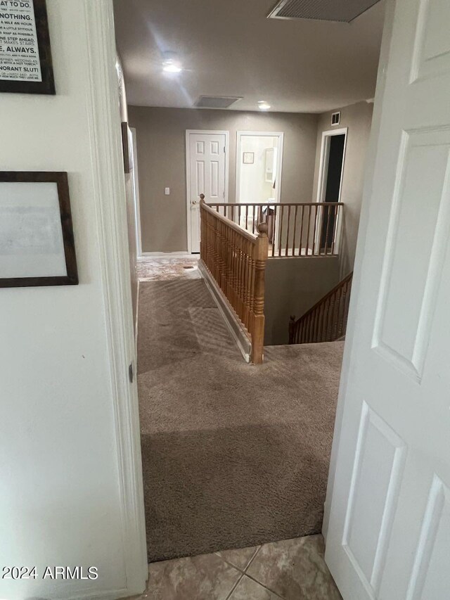 hallway featuring carpet floors