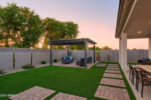 yard at dusk with outdoor lounge area, a pergola, a fenced backyard, and a patio area
