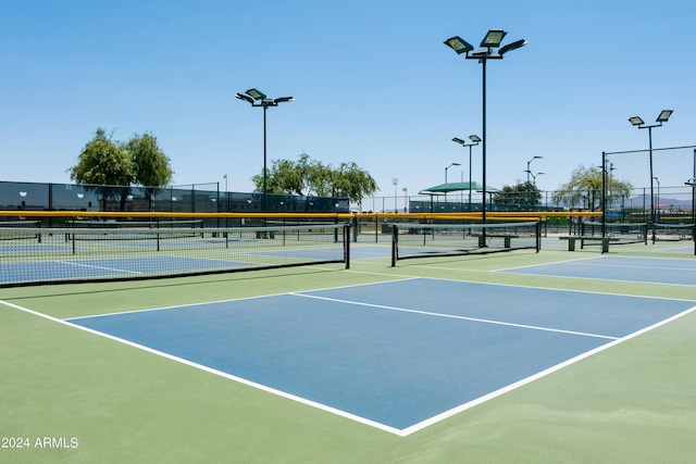 view of sport court featuring community basketball court and fence