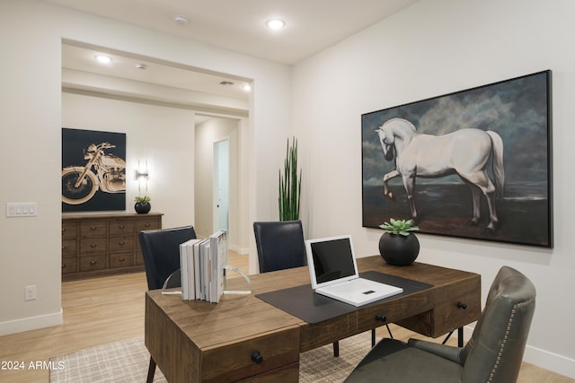 dining area with baseboards, recessed lighting, and light wood finished floors