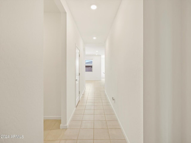 corridor featuring light tile patterned flooring