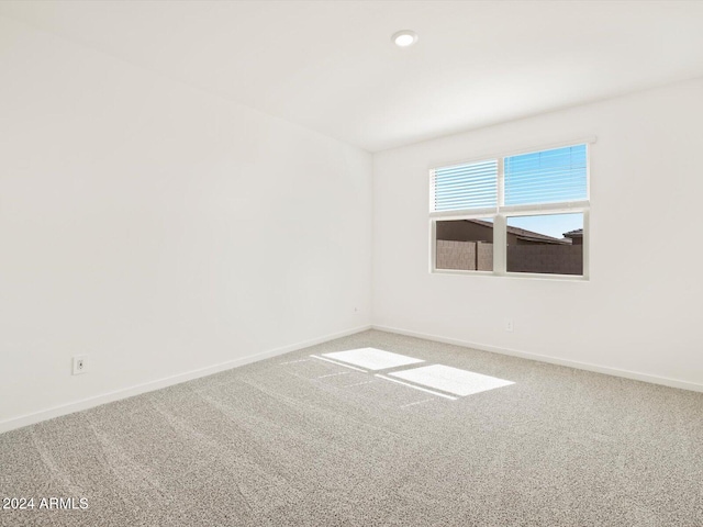 spare room with carpet