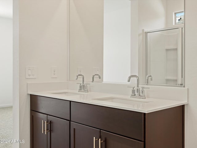 bathroom with vanity and an enclosed shower