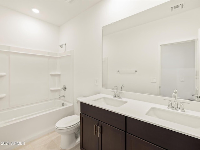 full bathroom featuring toilet, vanity, bathing tub / shower combination, and tile patterned floors