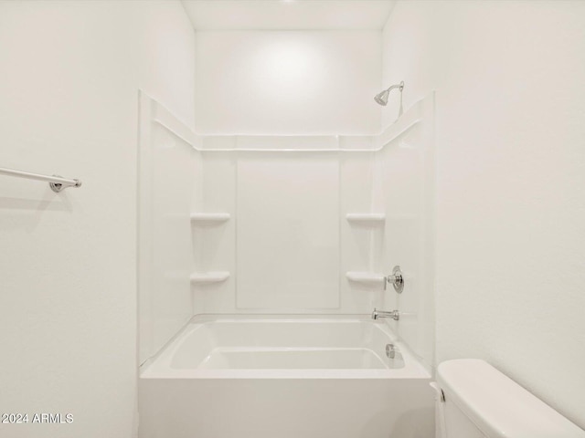 bathroom featuring toilet and shower / bathtub combination