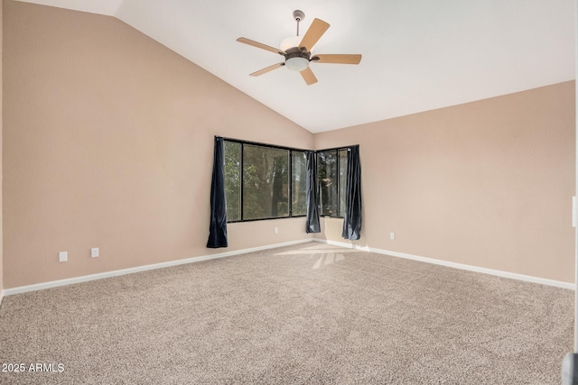 carpeted spare room featuring baseboards, high vaulted ceiling, and a ceiling fan