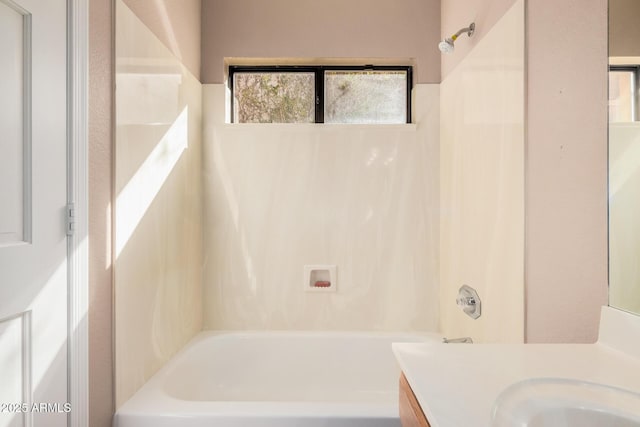 bathroom featuring tub / shower combination and vanity