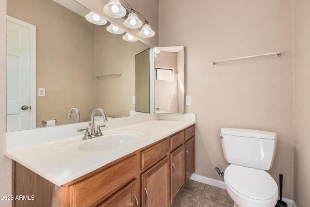 bathroom featuring tile patterned floors, baseboards, toilet, and vanity