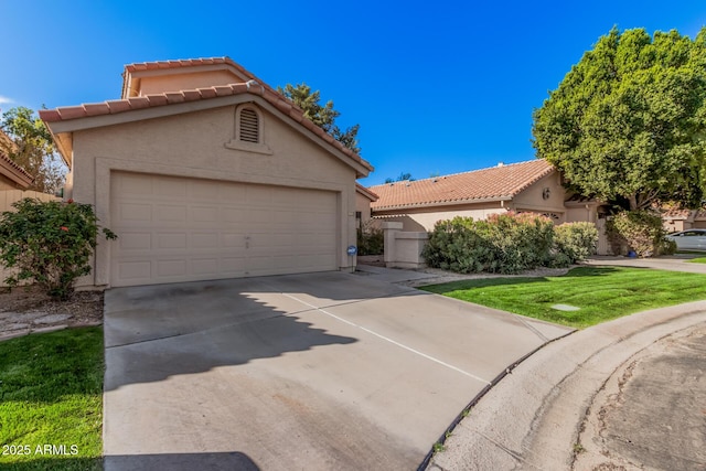 mediterranean / spanish house featuring stucco siding, driveway, and a tile roof