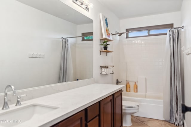 full bathroom with vanity, shower / bath combination with curtain, tile patterned floors, and toilet