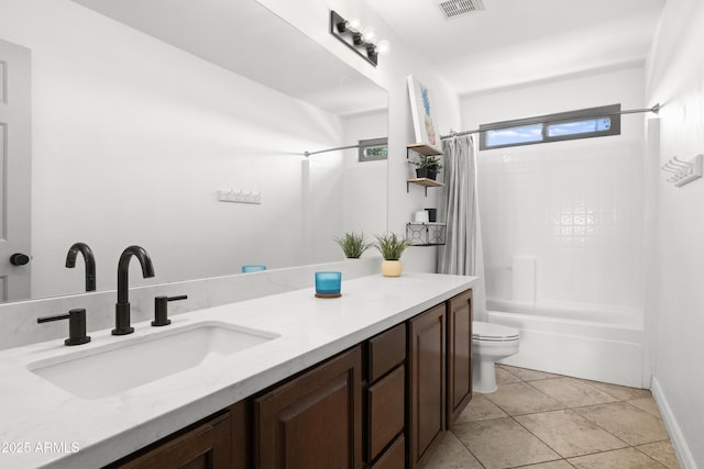 full bathroom featuring shower / tub combo, vanity, tile patterned floors, and toilet