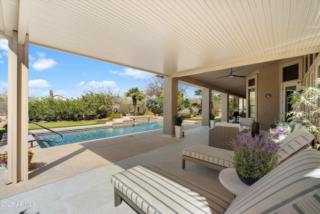 view of patio with ceiling fan and an outdoor pool