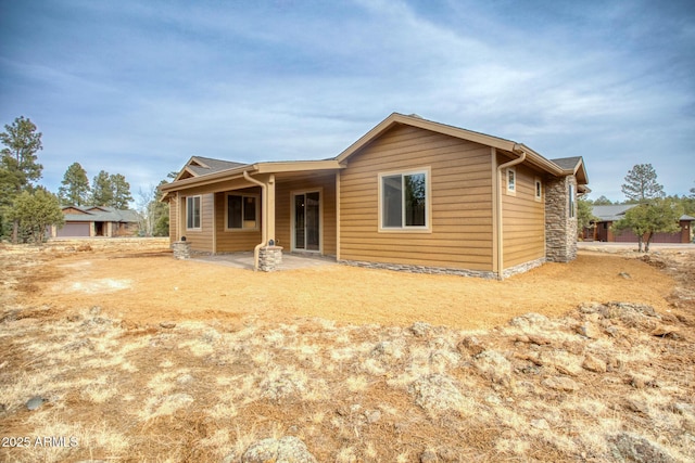 back of property featuring a patio