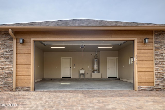 garage with sink and water heater