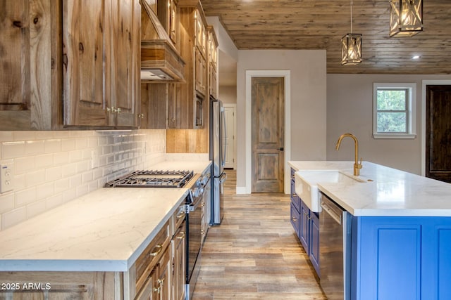 kitchen featuring tasteful backsplash, an island with sink, pendant lighting, wood ceiling, and custom range hood