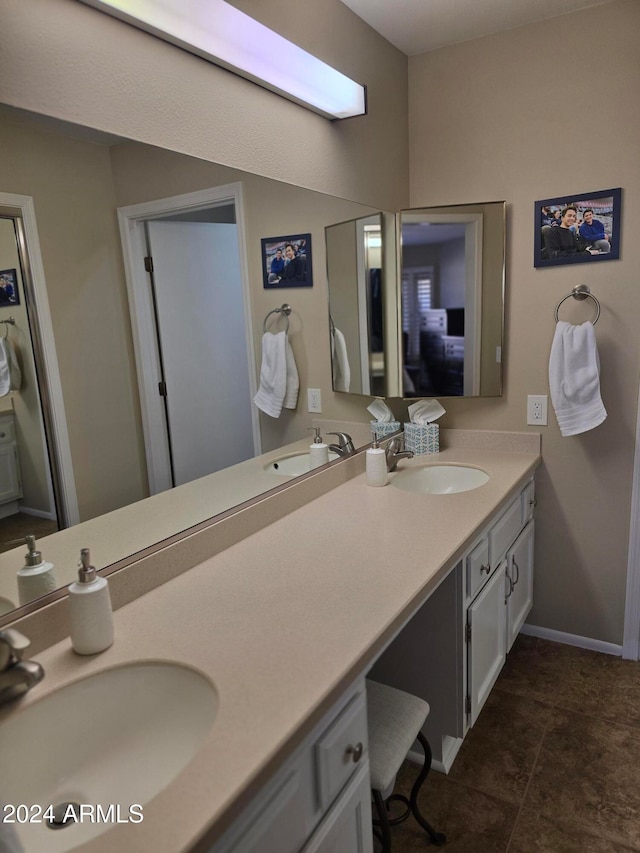 bathroom with tile patterned flooring and vanity