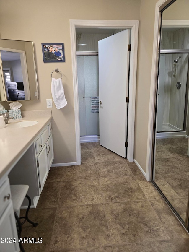 bathroom with vanity and an enclosed shower