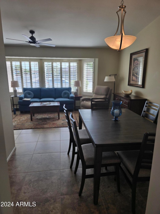 tiled dining room with ceiling fan