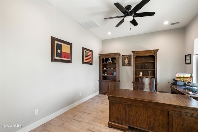 home office featuring light wood-type flooring and ceiling fan