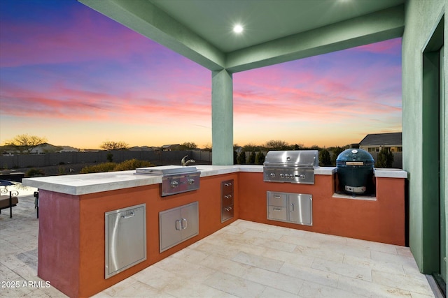 patio terrace at dusk with grilling area and area for grilling