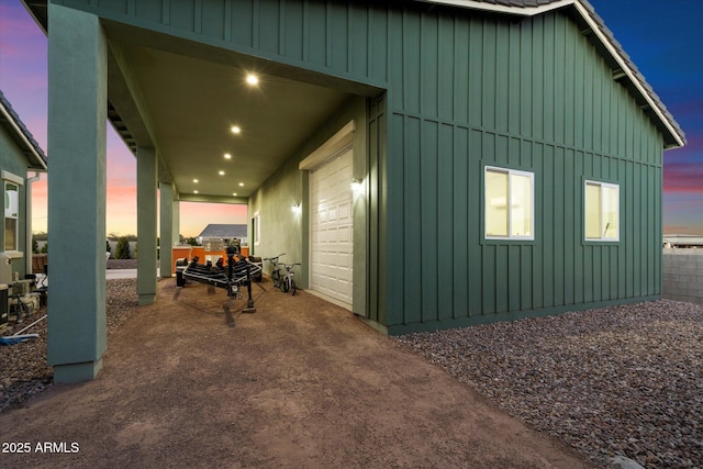 property exterior at dusk with a garage