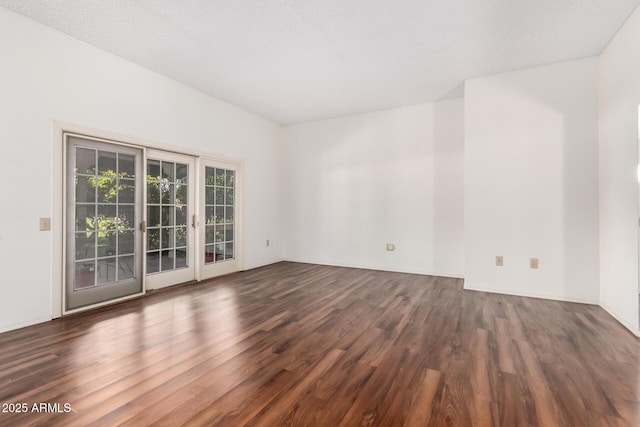 unfurnished room featuring dark hardwood / wood-style floors