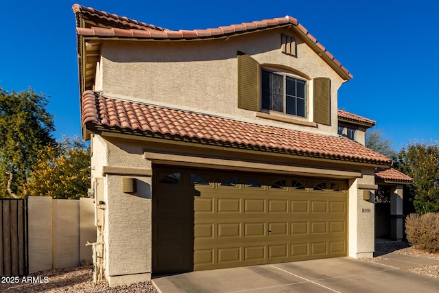 mediterranean / spanish-style home featuring a garage