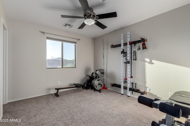 exercise room featuring ceiling fan and carpet