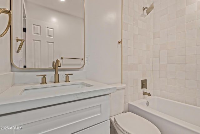bathroom featuring toilet, vanity, and shower / bathtub combination