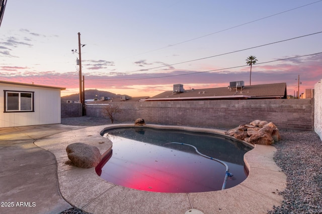 view of swimming pool with a fenced backyard, a patio area, and a fenced in pool