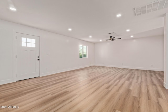 interior space with a ceiling fan, recessed lighting, light wood finished floors, and visible vents