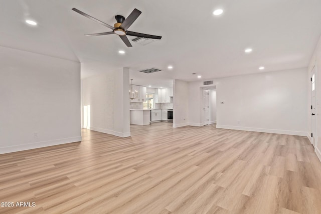 unfurnished living room featuring light wood-style flooring, recessed lighting, and visible vents