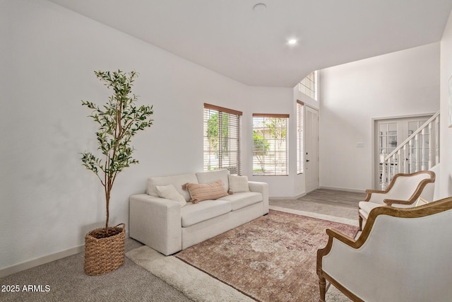 453 E Baylor Ln, Gilbert, AZ 85296 - carpeted living room featuring stairs and baseboards