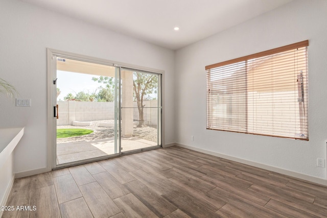 453 E Baylor Ln, Gilbert, AZ 85296 - spare room with wood finished floors, baseboards, and recessed lighting