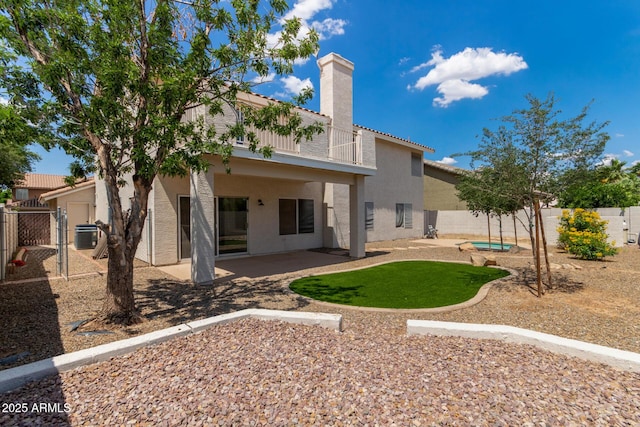 453 E Baylor Ln, Gilbert, AZ 85296 - rear view of property with stucco siding, a patio, a fenced backyard, and a chimney