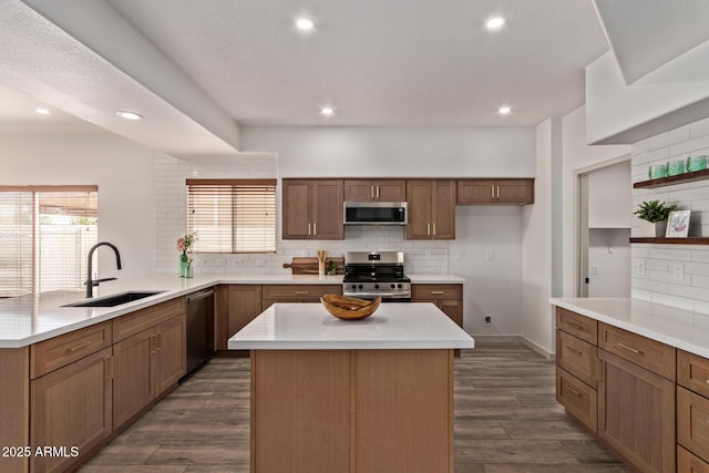 453 E Baylor Ln, Gilbert, AZ 85296 - kitchen featuring appliances with stainless steel finishes, a sink, backsplash, light countertops, and a peninsula