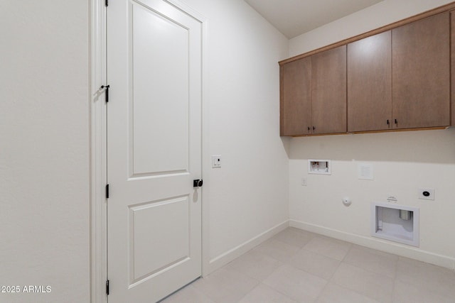 washroom with electric dryer hookup, hookup for a gas dryer, cabinet space, baseboards, and hookup for a washing machine