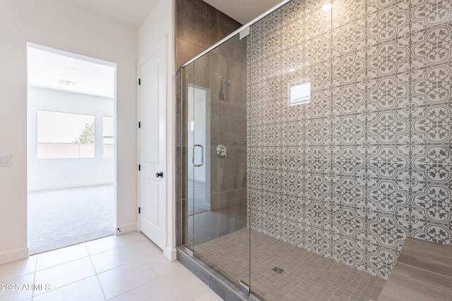 full bath with tile patterned floors, visible vents, a shower stall, and baseboards